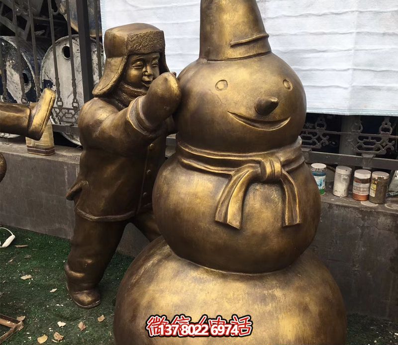 景區(qū)銅雕堆雪人兒童雕塑戴帽子 景區(qū)銅雕堆雪人兒童雕塑戴帽子